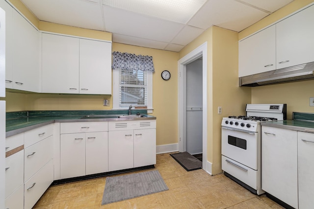 kitchen featuring white cabinetry, sink, white range with gas stovetop, and a drop ceiling