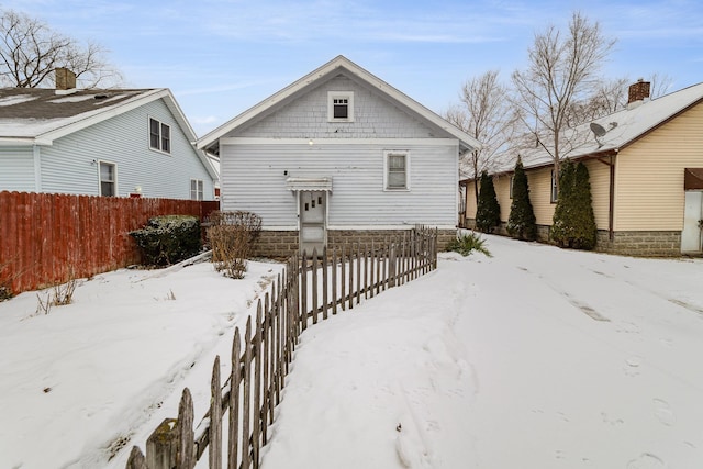 view of snow covered house