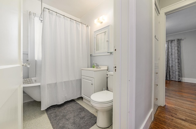 full bathroom with vanity, shower / tub combo, wood-type flooring, and toilet