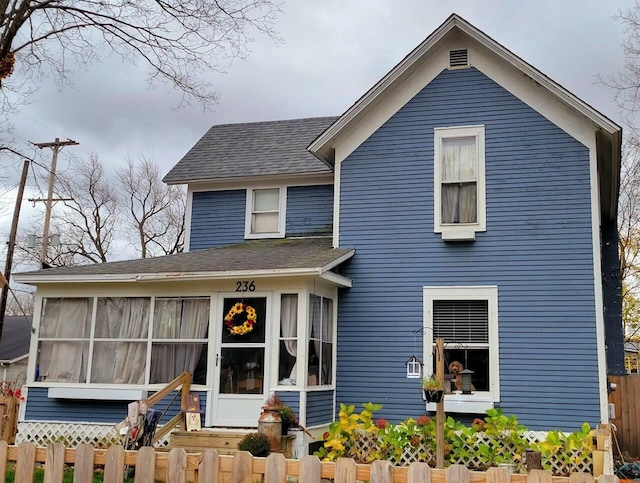 view of front of property featuring a sunroom