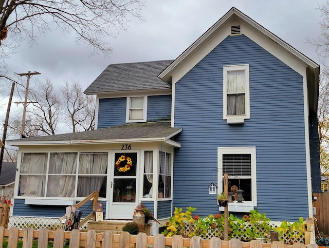 view of front of home featuring a sunroom