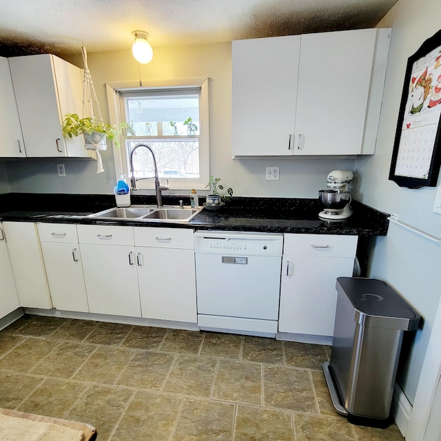 kitchen featuring white cabinetry, dishwasher, and sink