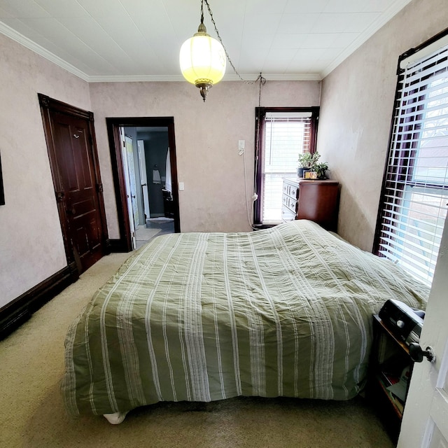 carpeted bedroom featuring crown molding