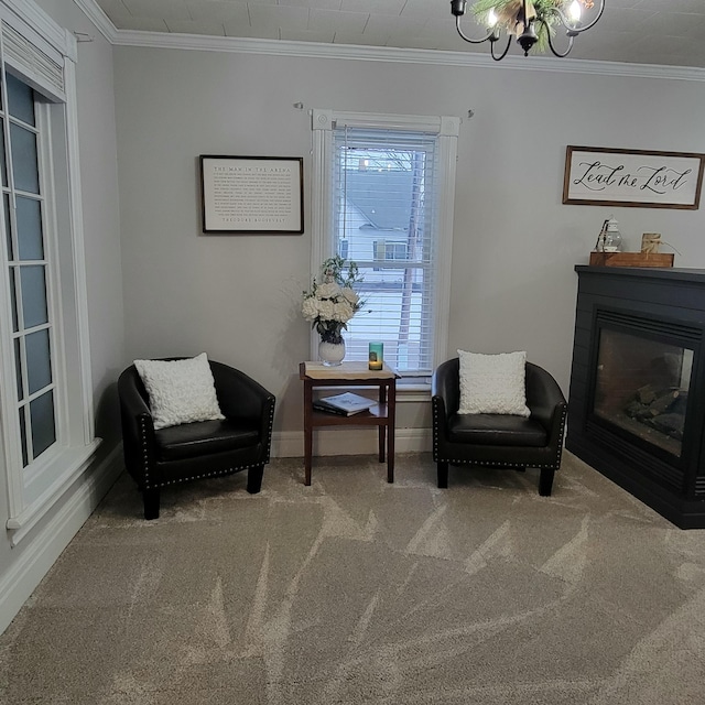 sitting room featuring crown molding, a chandelier, and carpet