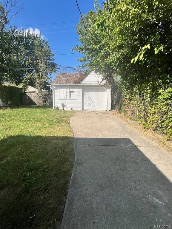 garage featuring a yard