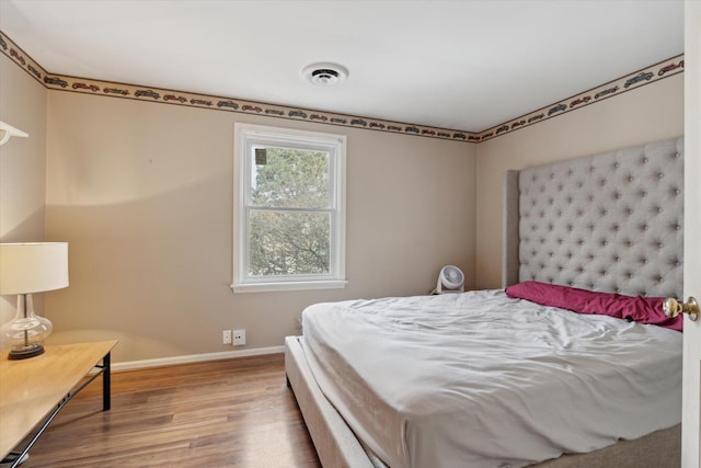 bedroom featuring hardwood / wood-style floors