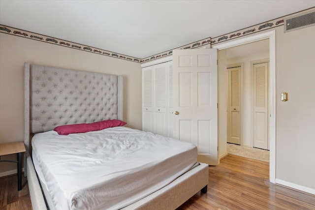 bedroom featuring hardwood / wood-style flooring and a closet