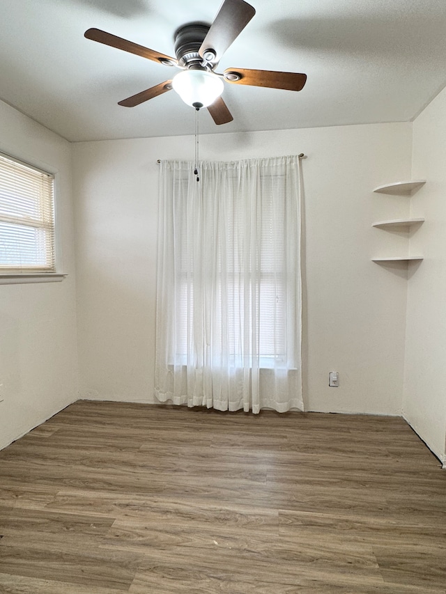 spare room with wood-type flooring