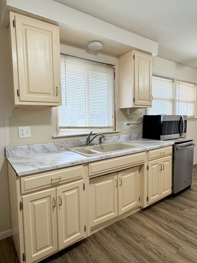 kitchen featuring sink, dark wood-type flooring, and stainless steel appliances