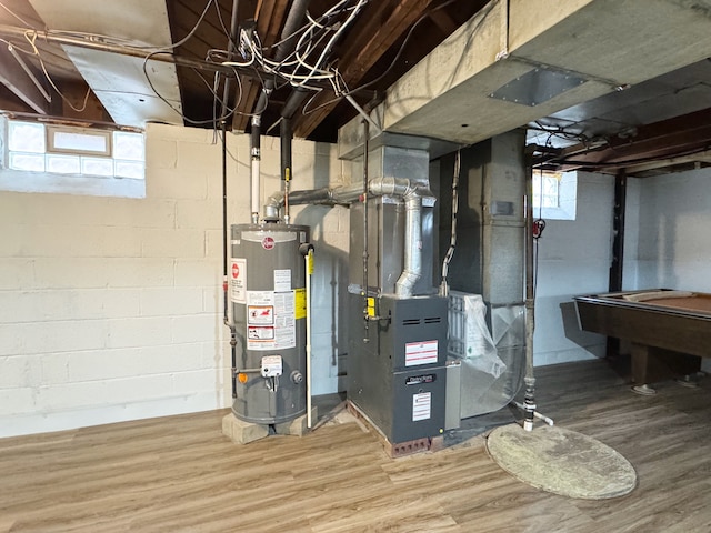 utility room with water heater and heating unit