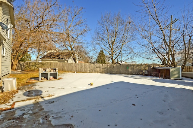 view of yard layered in snow