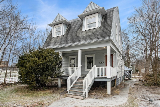 cape cod-style house featuring a porch