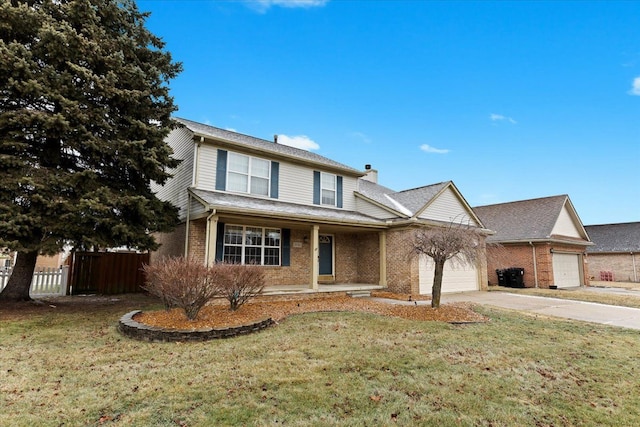 view of front property with a garage, a front yard, and covered porch