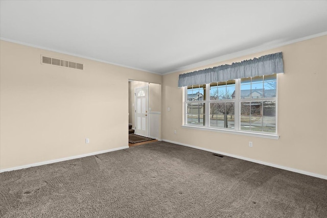 carpeted empty room with crown molding