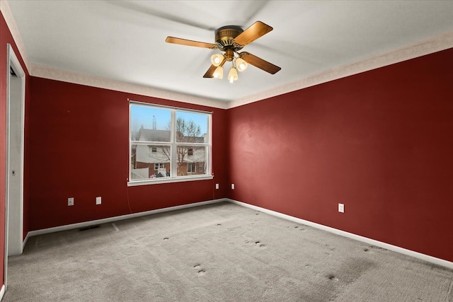 unfurnished room featuring carpet floors and ceiling fan