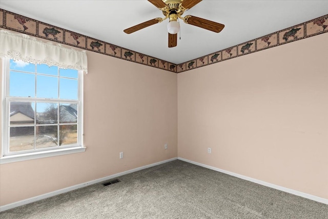 carpeted empty room with ceiling fan