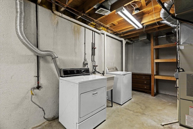 laundry room featuring sink and washing machine and dryer