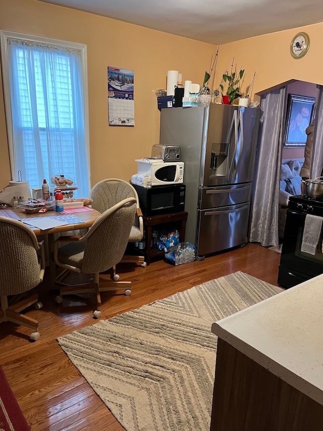 dining area featuring dark hardwood / wood-style floors