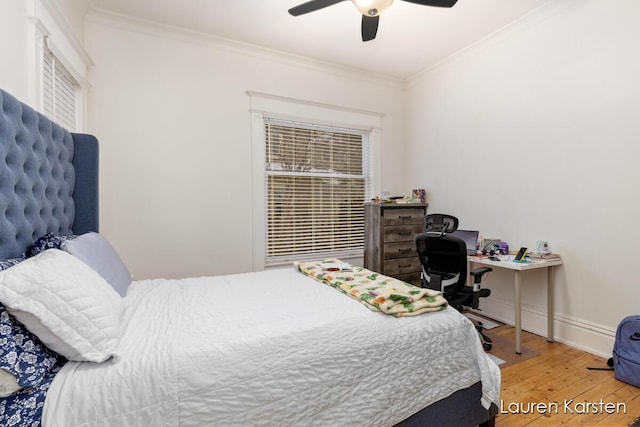 bedroom featuring crown molding, ceiling fan, and hardwood / wood-style flooring