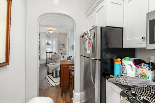 kitchen with white cabinetry, dark wood-type flooring, and stainless steel appliances