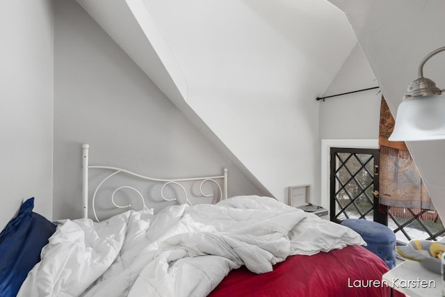 bedroom with vaulted ceiling