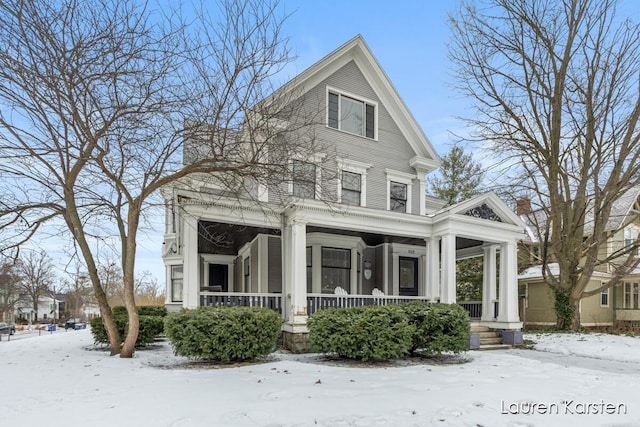 neoclassical / greek revival house featuring covered porch