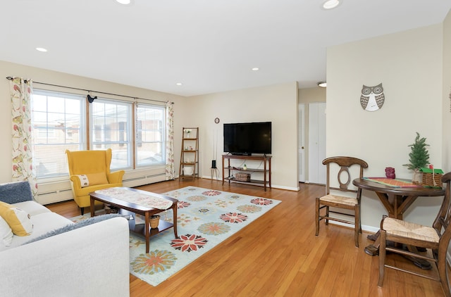 living room with hardwood / wood-style flooring and a baseboard radiator