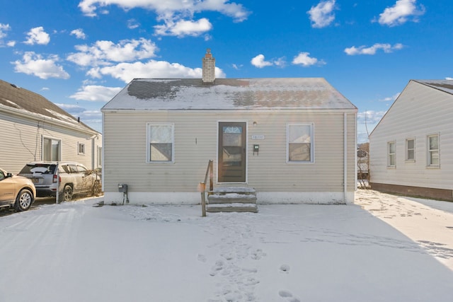 view of snow covered house