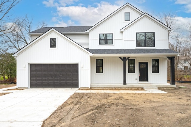 5090 Crandall Rd, Howell, MI 48855 - modern inspired farmhouse with covered porch, roof with shingles, and concrete driveway