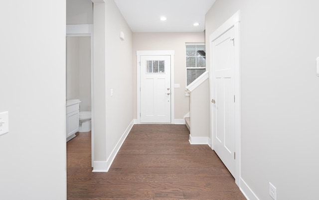 5090 Crandall Rd, Howell, MI 48855 - hall featuring dark wood finished floors, recessed lighting, baseboards, and stairway