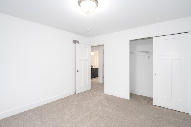 5090 Crandall Rd, Howell, MI 48855 - unfurnished bedroom featuring carpet floors, baseboards, and a closet