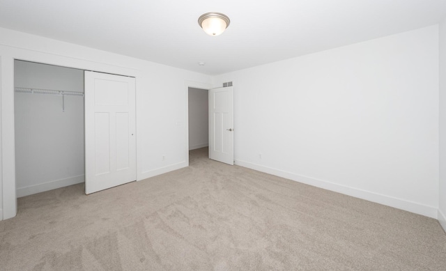 5090 Crandall Rd, Howell, MI 48855 - unfurnished bedroom featuring carpet flooring, a closet, and baseboards