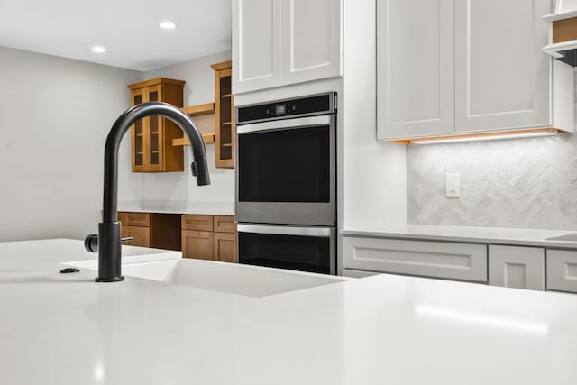 8200 Pine Ridge Ct, Northville, MI 48168 - kitchen featuring open shelves, backsplash, light countertops, recessed lighting, and stainless steel double oven