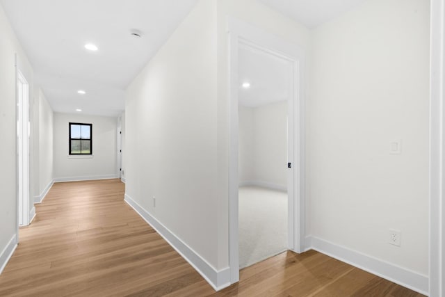 2735 Blue Bird Ln, Highland, MI 48357 - hall featuring light wood finished floors, baseboards, and recessed lighting