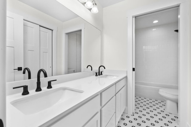 2735 Blue Bird Ln, Highland, MI 48357 - full bath featuring toilet and double vanity