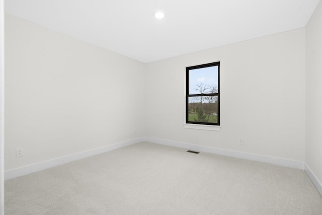 2735 Blue Bird Ln, Highland, MI 48357 - empty room featuring light carpet, baseboards, and recessed lighting