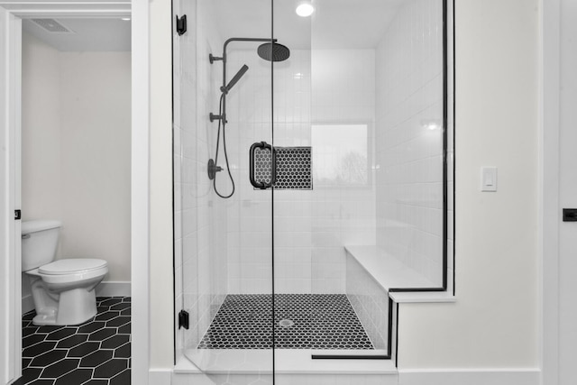 2735 Blue Bird Ln, Highland, MI 48357 - bathroom featuring toilet, a stall shower, tile patterned floors, and recessed lighting
