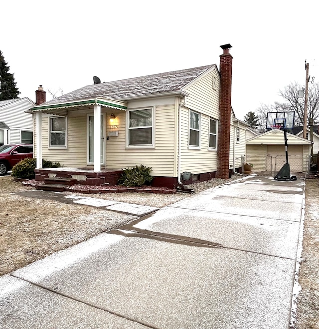 bungalow-style house with an outbuilding and a garage