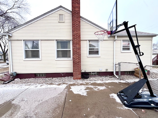 view of snowy exterior with a patio area