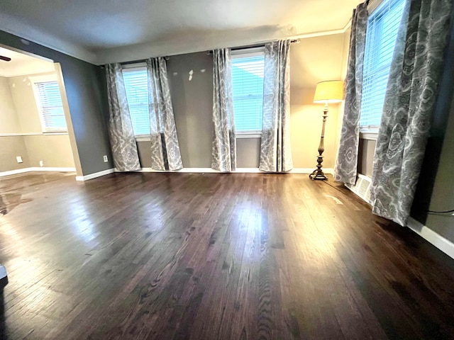 unfurnished living room with hardwood / wood-style floors