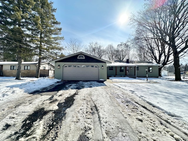 ranch-style house with a garage, driveway, and fence