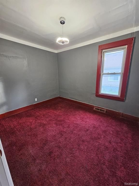 unfurnished room with carpet floors