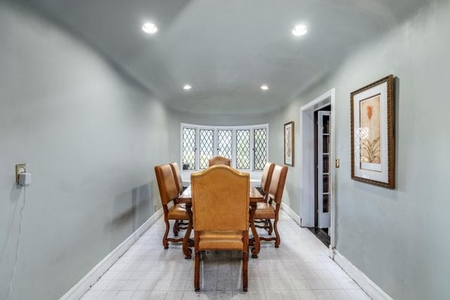 dining space with recessed lighting and baseboards