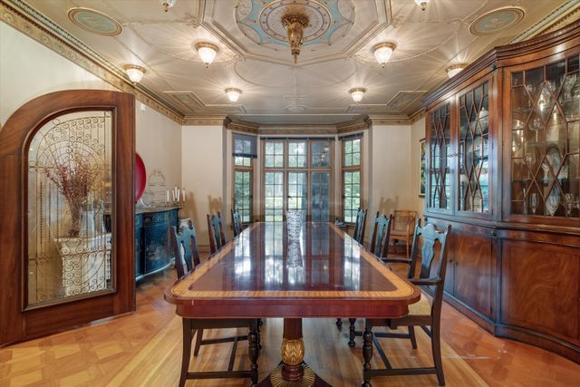 dining space featuring crown molding