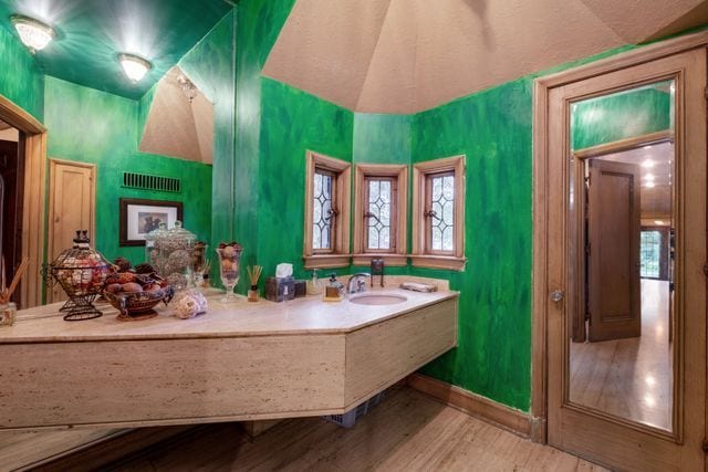 bathroom with vanity and hardwood / wood-style floors