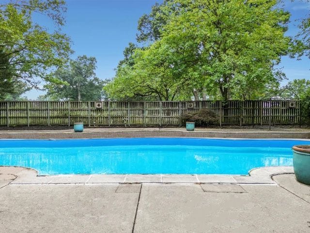 view of pool featuring a fenced in pool and fence