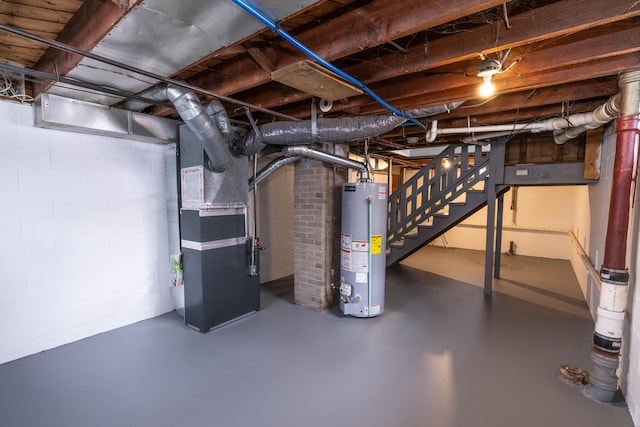 basement featuring heating unit and gas water heater