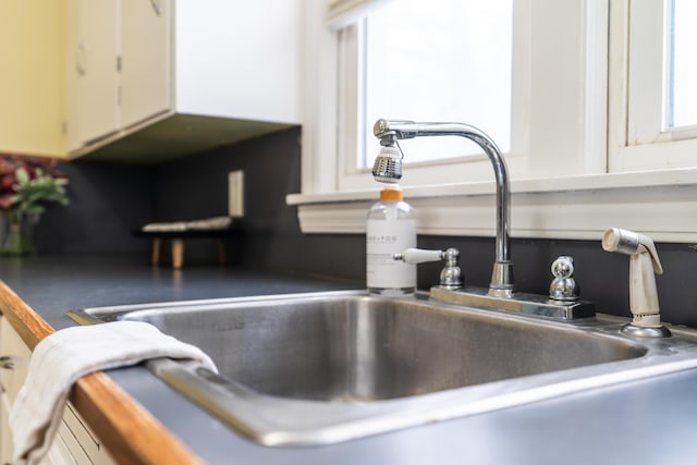 room details with sink and white cabinets