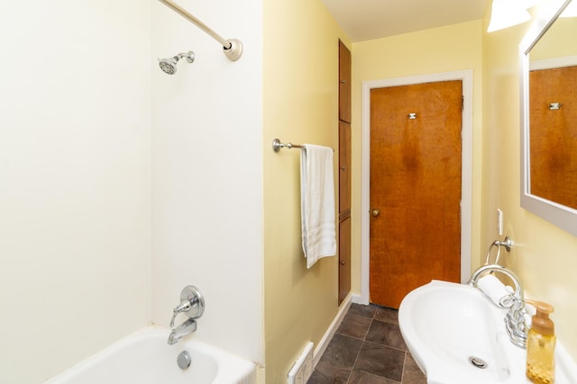 bathroom featuring shower / washtub combination and sink