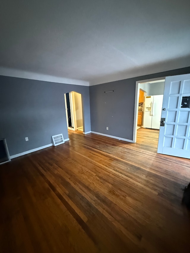 spare room with wood-type flooring